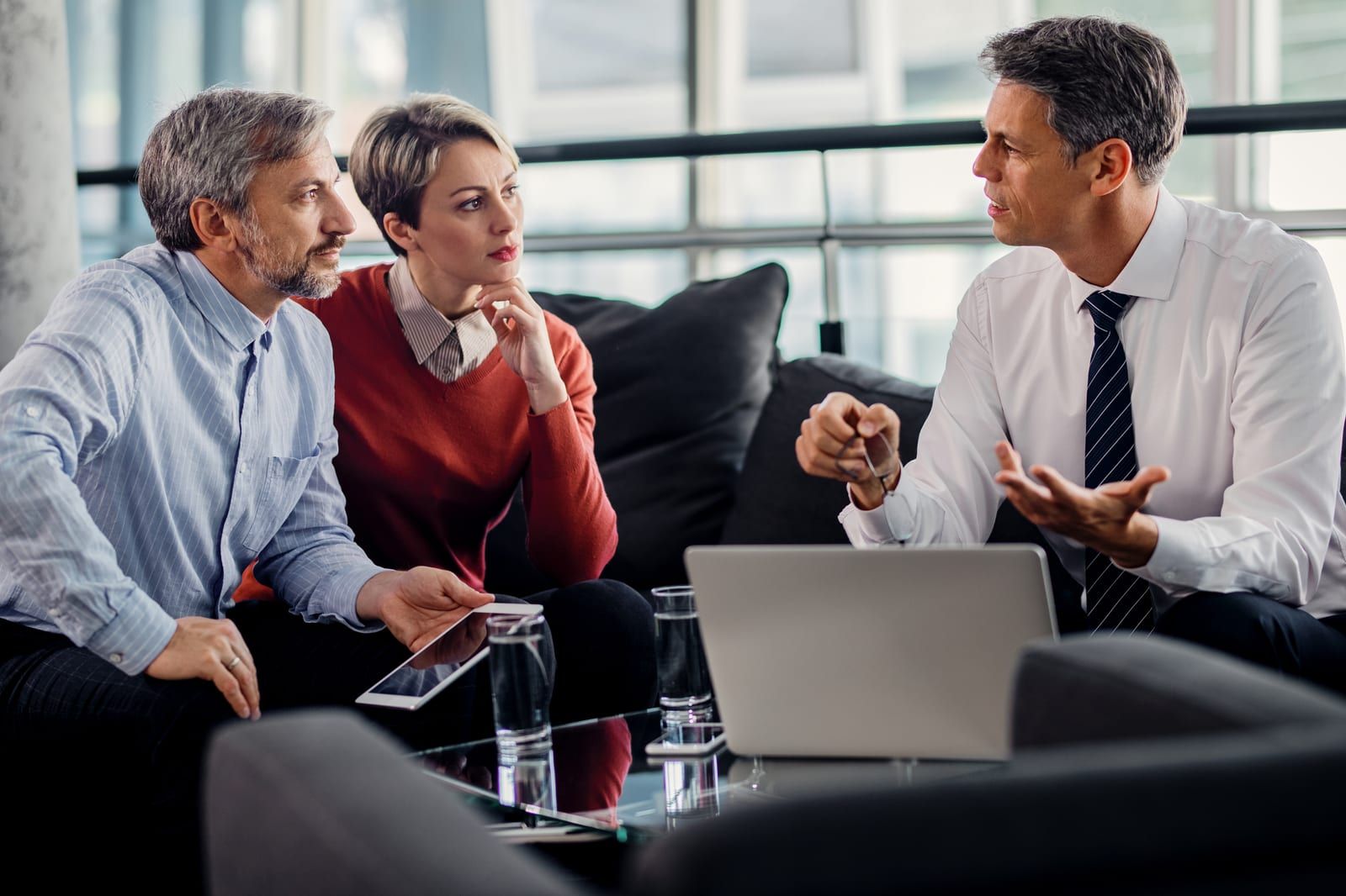 Insurance agent meeting with a couple in an office
