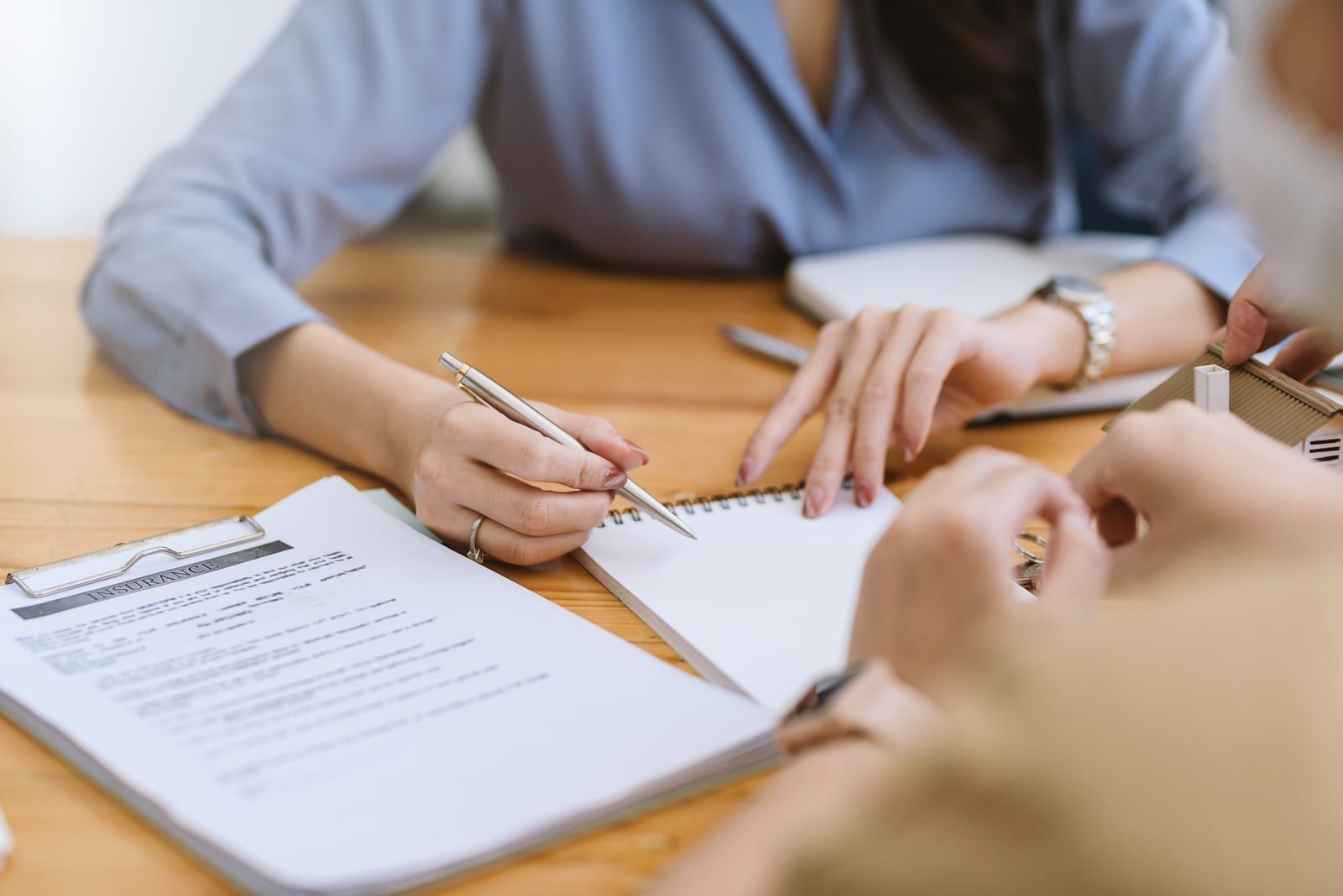 Insurance agents presenting a policy to a customer